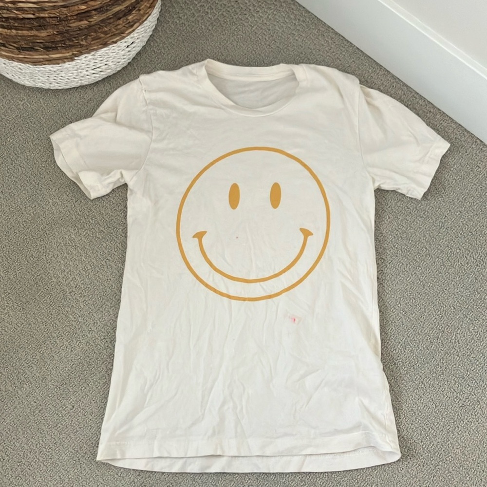 White smiley face shirt
